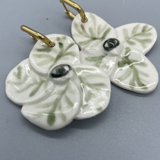 Pendientes flor ojo verde